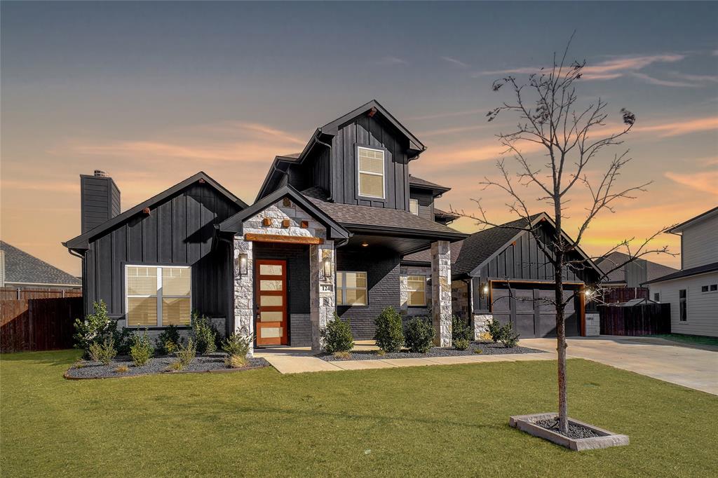 124 William Lane Godley, TX 76044 - Photo 4 of 32 a front view of a house with a yard