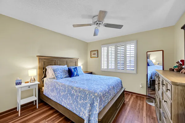 a bedroom with a bed and a table