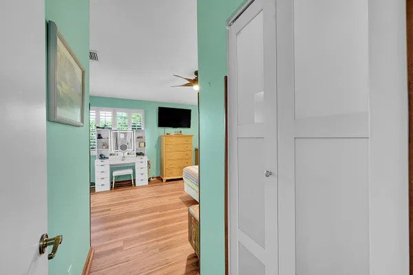 a view of kitchen with furniture and wooden floor