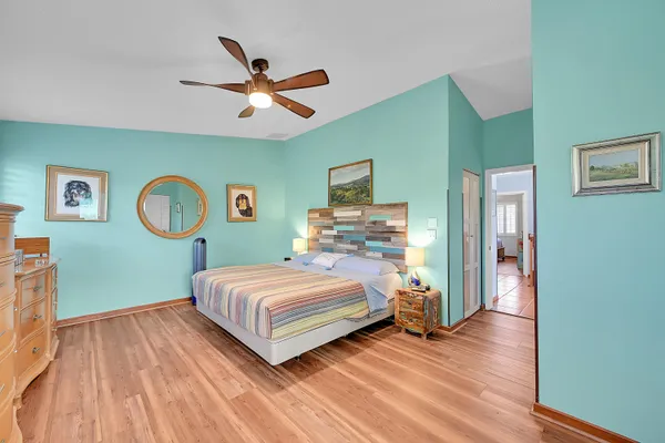 a bedroom with a bed and a table