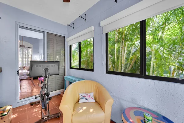 a view of a chairs and table in a garden
