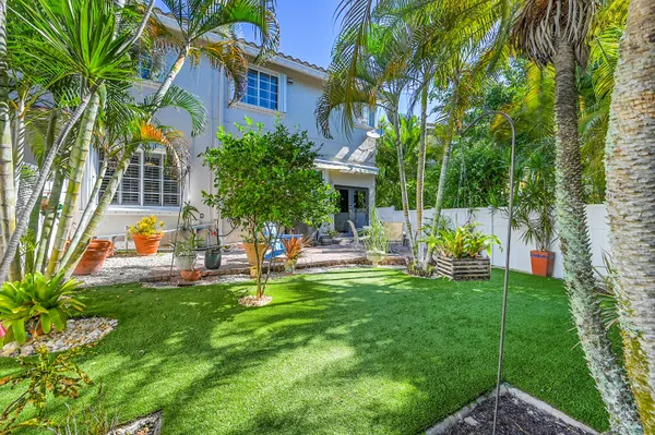 a view of a house with a yard porch and sitting area