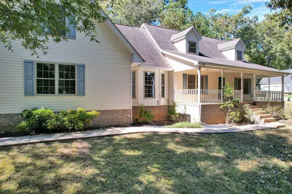 a front view of a house with garden