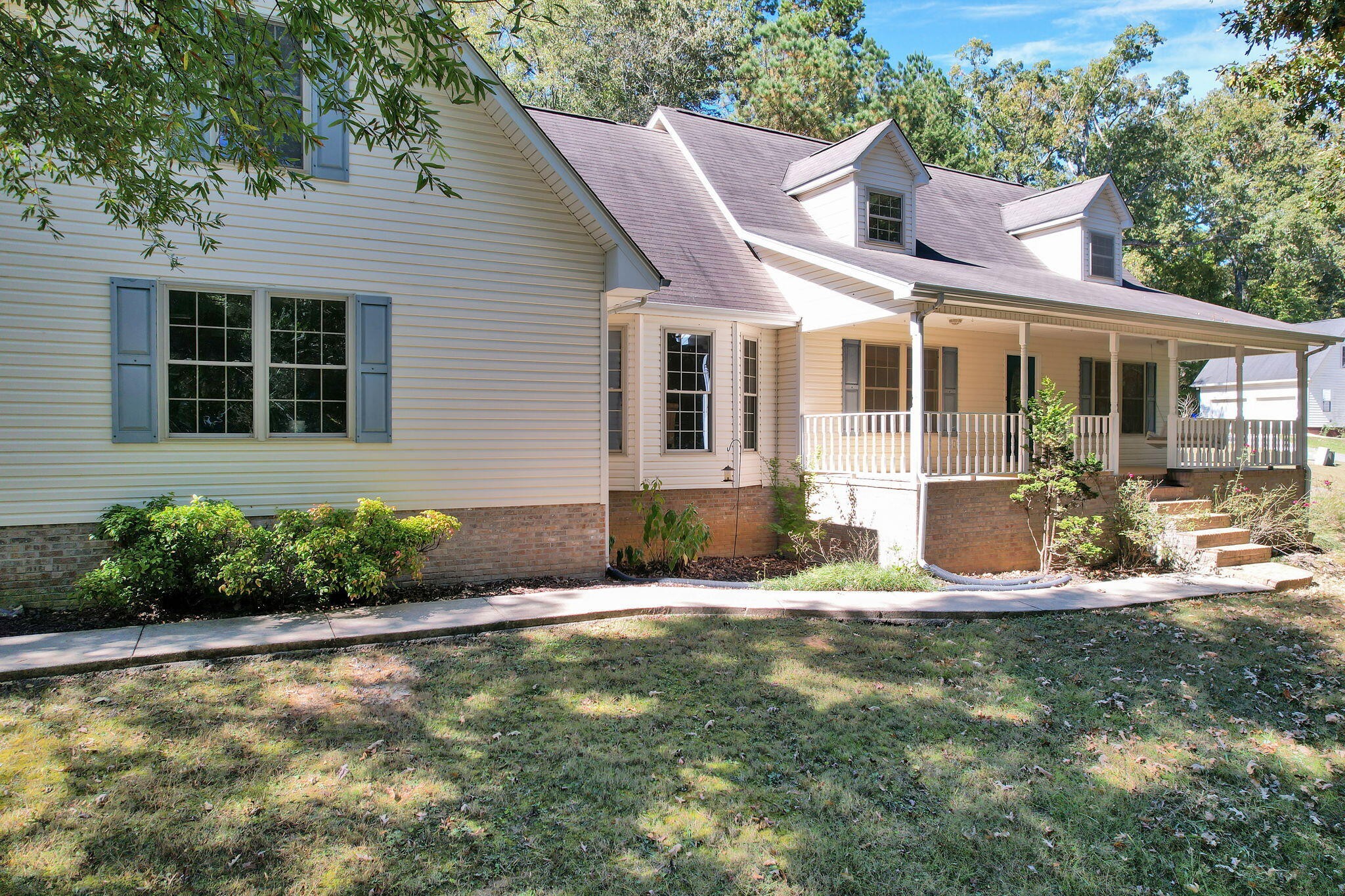 a front view of a house with garden