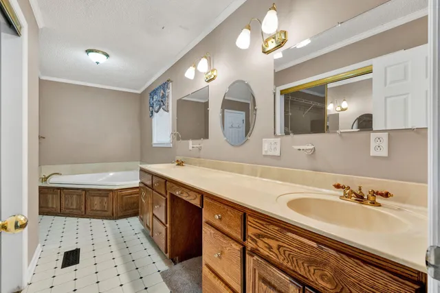 a bathroom with a sink a toilet and a shower