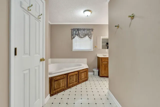 a view of a bathroom with grey walls