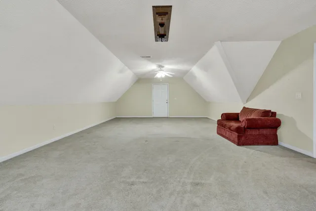 a view of a garage with a car and car