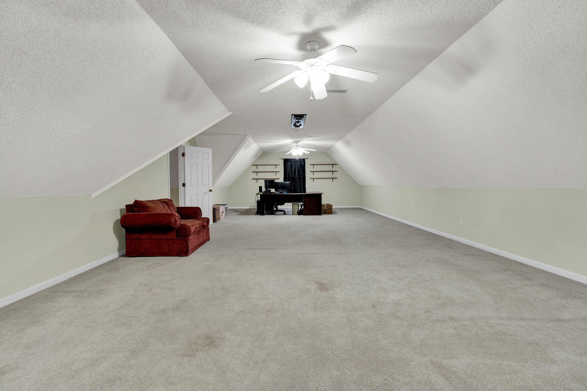 1582 Eads Bluff Road Northwest Georgetown, TN 37336 - Photo 34 of 57 an empty room with a chandelier fan and a large window