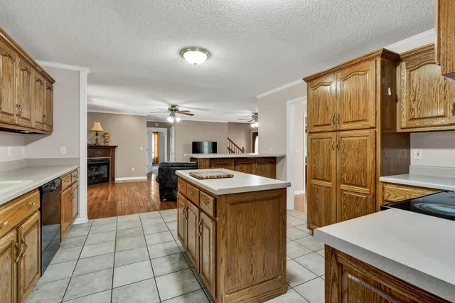 a kitchen with stainless steel appliances granite countertop a stove sink microwave and cabinets