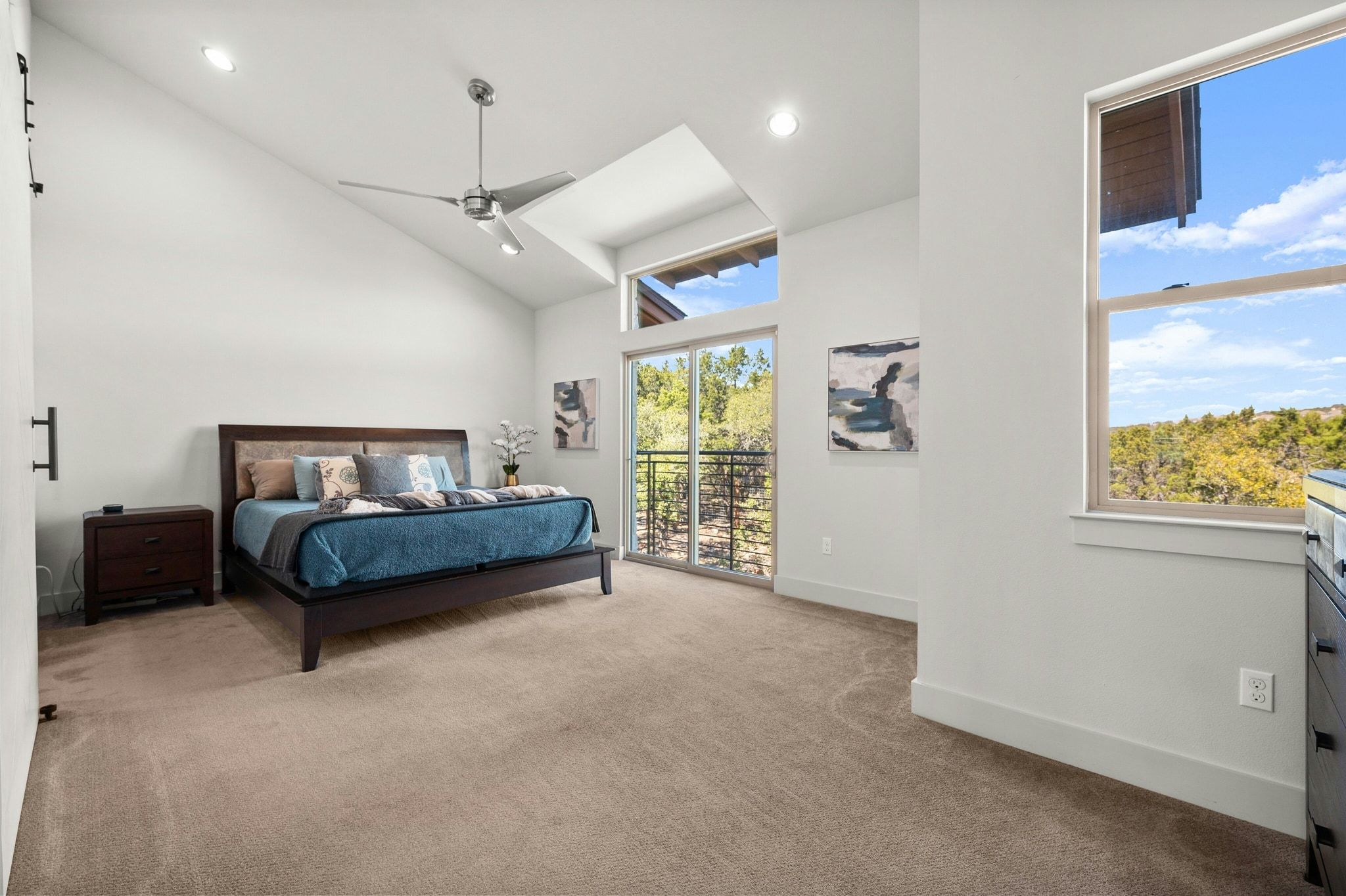8110 Ranch Road 2222, Unit 92 Austin, TX 78730 - Photo 13 of 40 Vaulted ceiling bedroom featuring ample natural light, recessed lighting, a modern ceiling fan, and direct access to an outdoor balcony