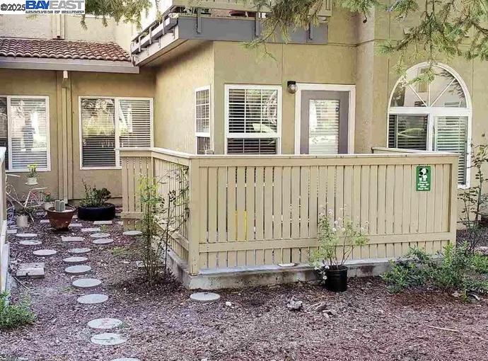 1405 Forest Run Hercules, CA 94547 - Photo 20 of 21 a view of a house with backyard and wooden fence