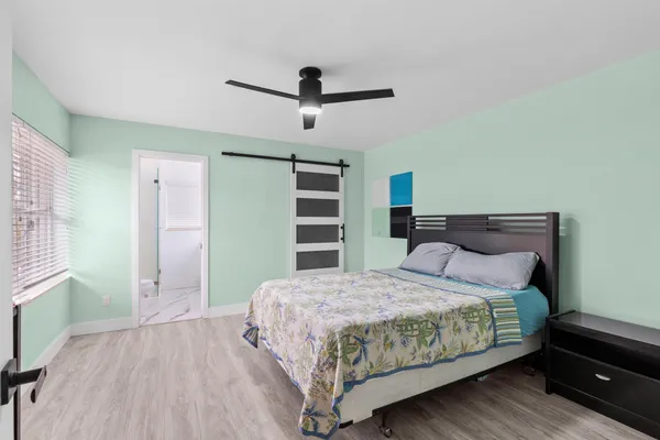 a bedroom with a bed and a walk in closet