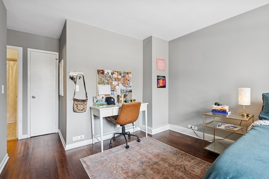 40 East Cedar Street, Unit 4D Chicago, IL 60611 - Photo 12 of 18 a workspace with furniture and wooden floor