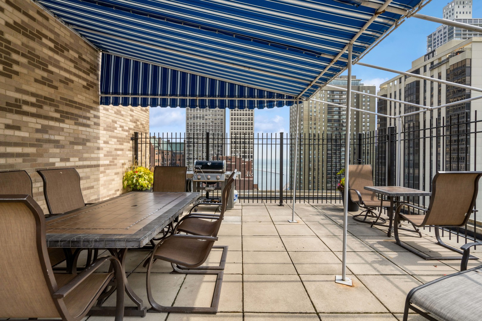 40 East Cedar Street, Unit 4D Chicago, IL 60611 - Photo 16 of 18 a view of a chairs and table in the patio