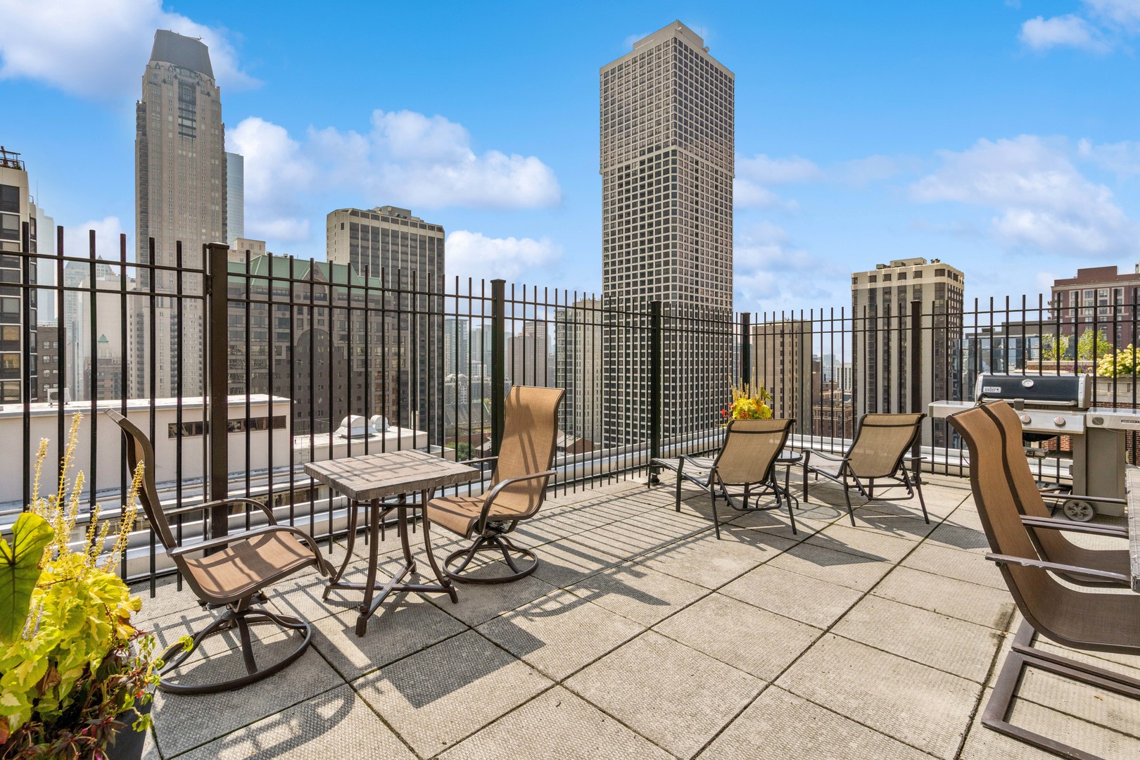 40 East Cedar Street, Unit 4D Chicago, IL 60611 - Photo 17 of 18 a view of balcony with two chairs and iron fence