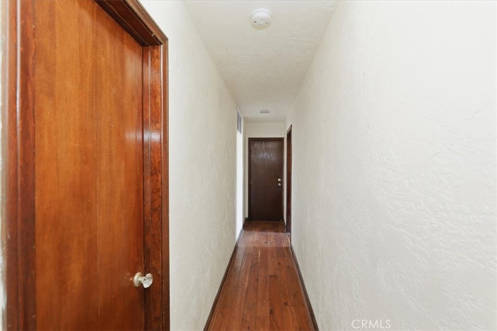 17394 Sunset View Drive Riverside, CA 92504 - Photo 23 of 62 Hallway to garage