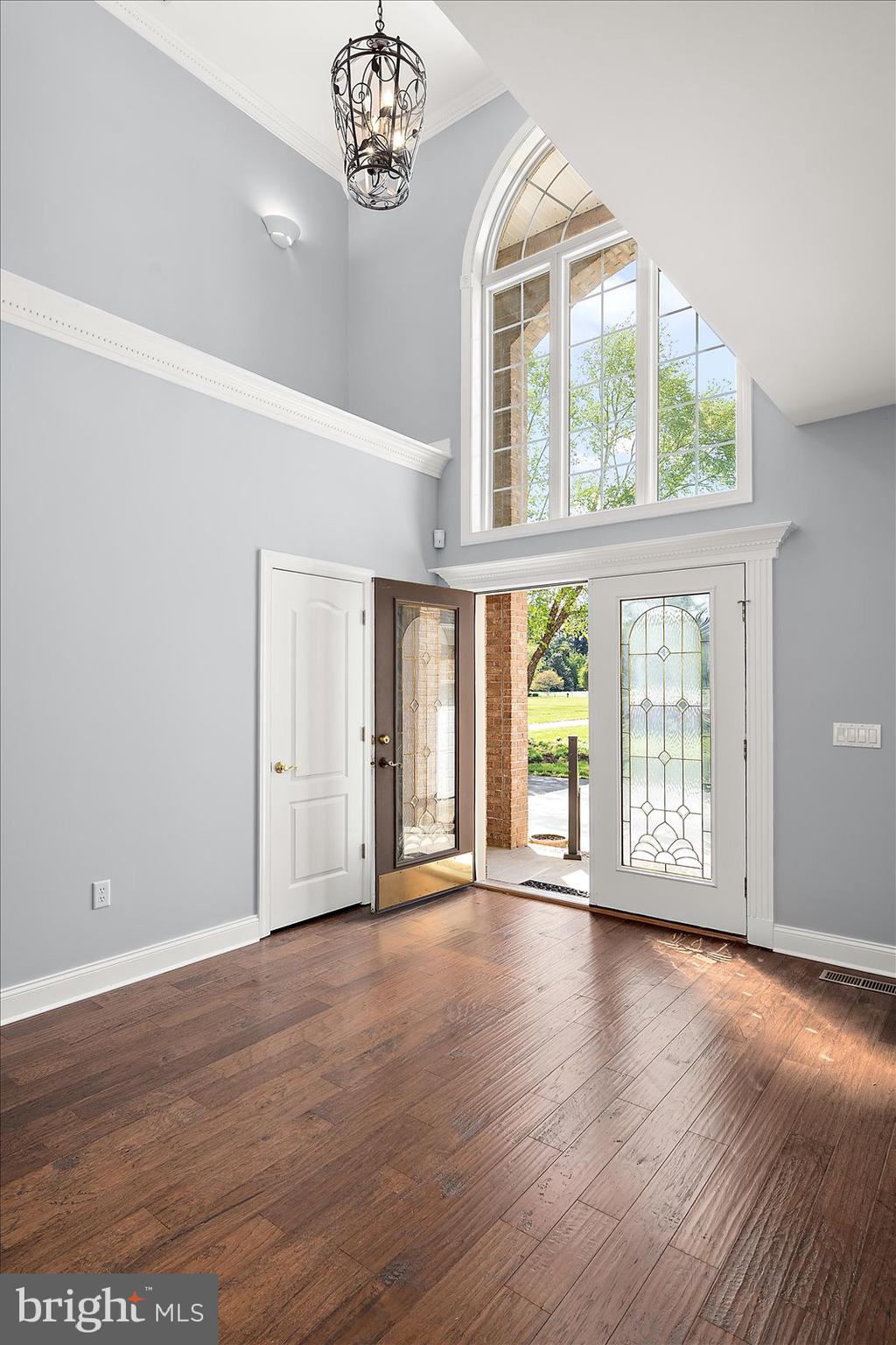 3431 Redden Ferry Road Eden, MD 21822 - Photo 14 of 103 a view of an empty room with wooden floor and a window