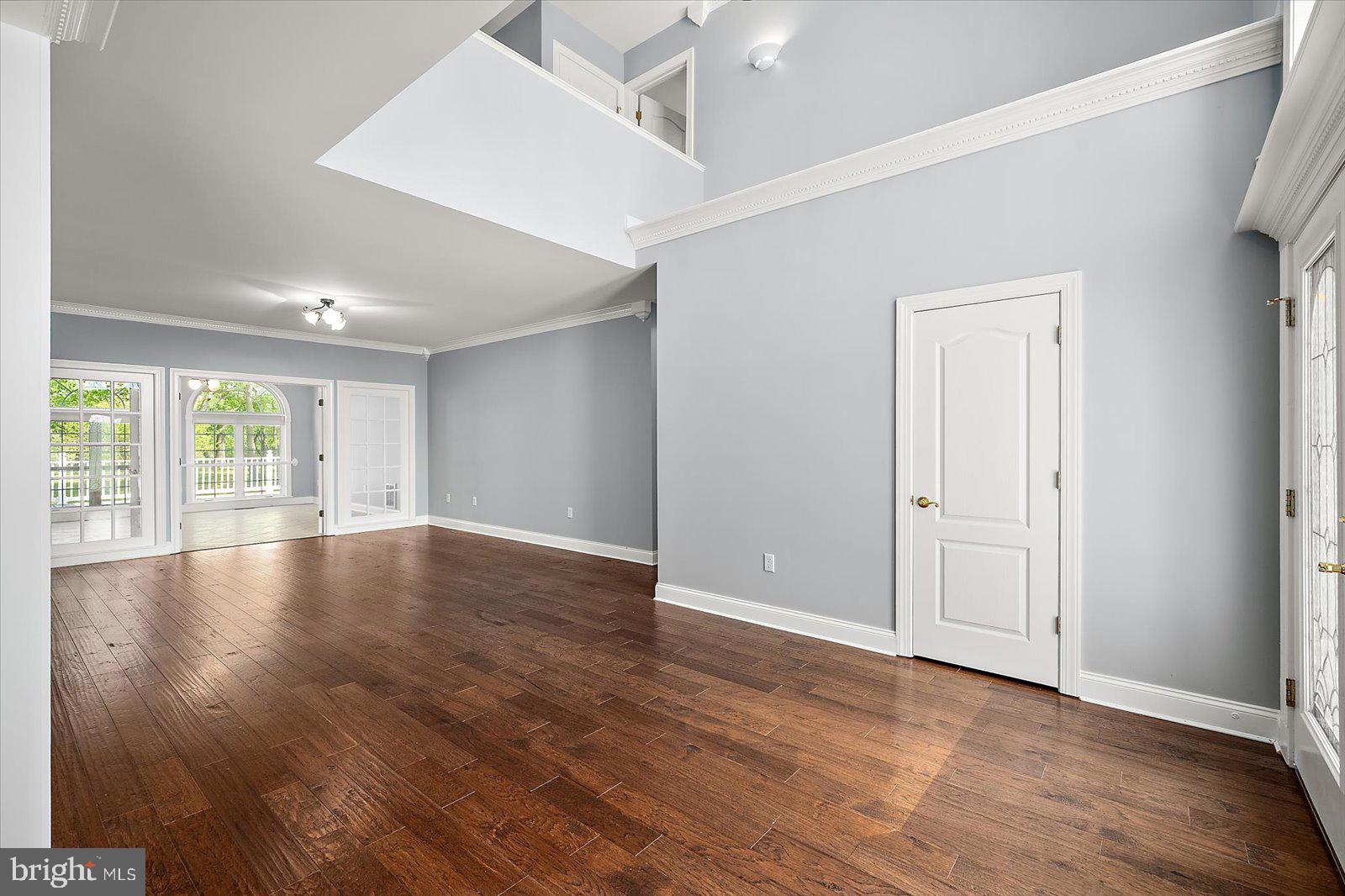 3431 Redden Ferry Road Eden, MD 21822 - Photo 17 of 103 an empty room with wooden floor and windows