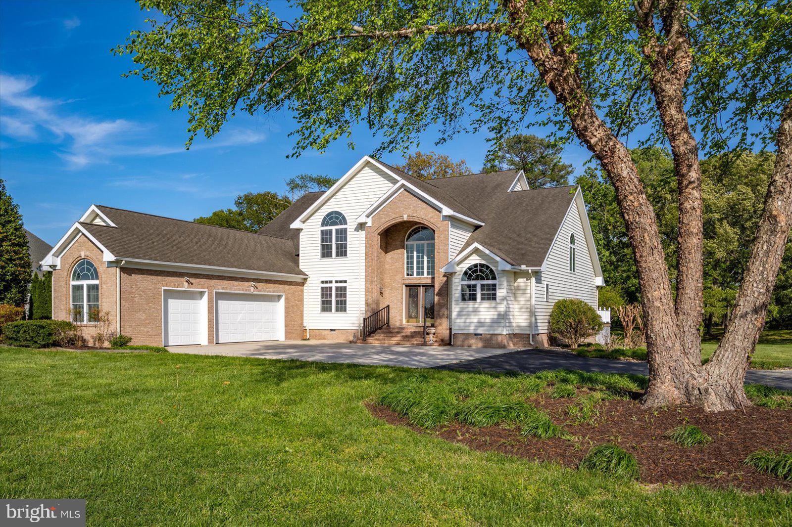 3431 Redden Ferry Road Eden, MD 21822 - Photo 3 of 103 a front view of a house with a garden and trees