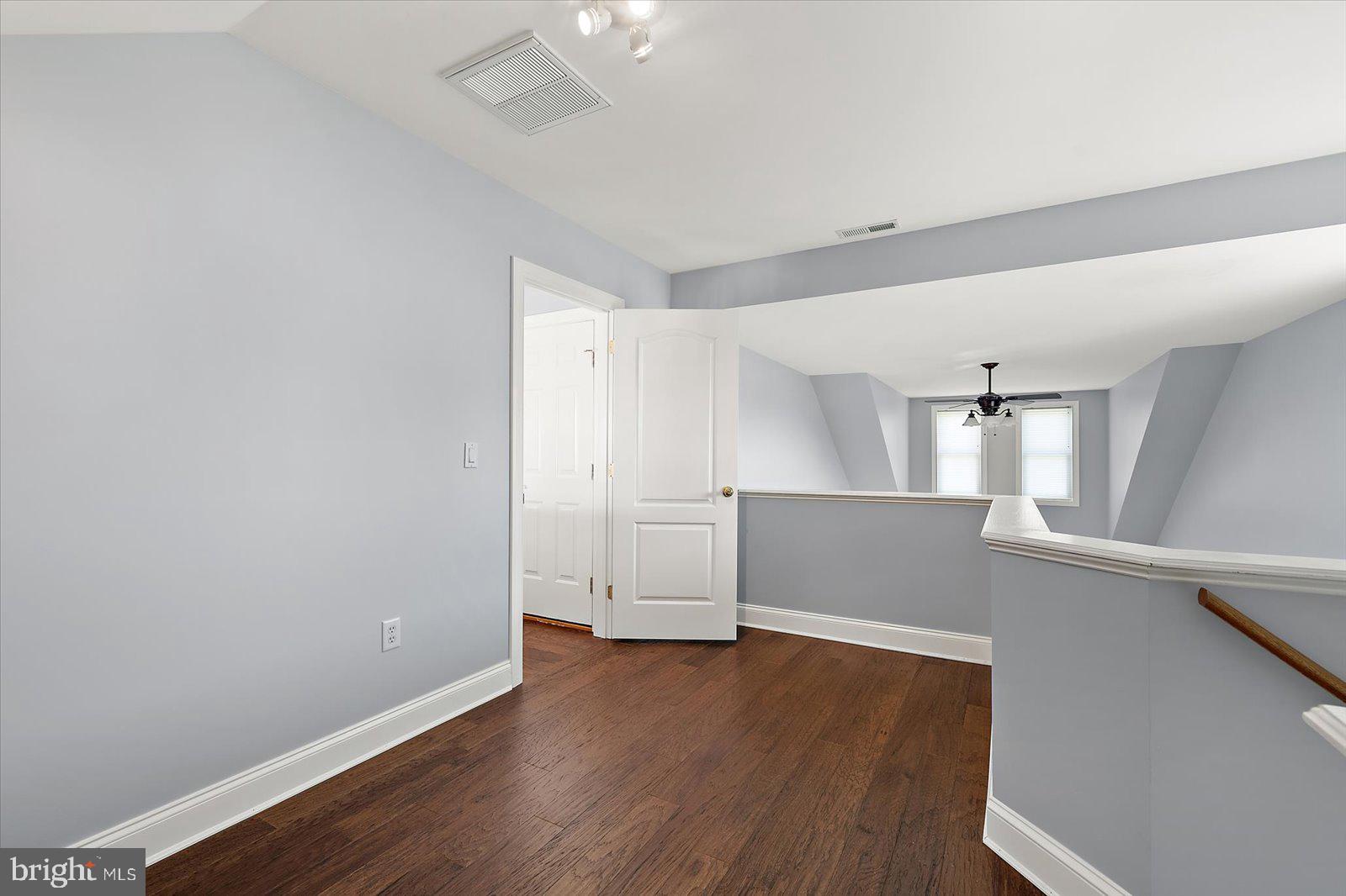 3431 Redden Ferry Road Eden, MD 21822 - Photo 45 of 103 an empty room with wooden floor and windows