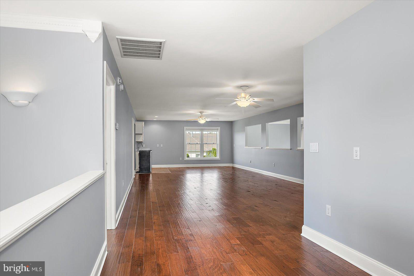 3431 Redden Ferry Road Eden, MD 21822 - Photo 55 of 103 a view of empty room with wooden floor and fan