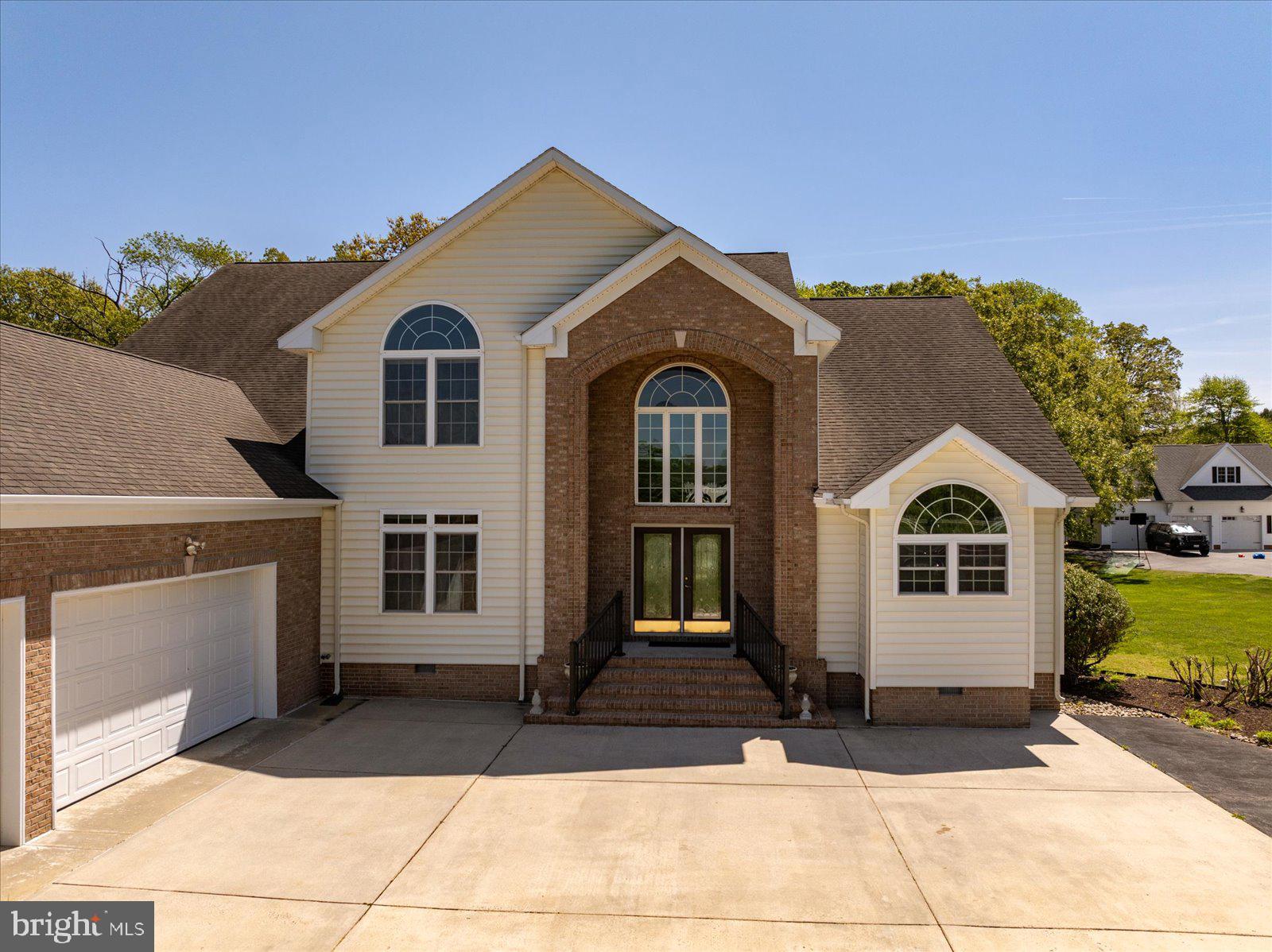 3431 Redden Ferry Road Eden, MD 21822 - Photo 88 of 103 a front view of a house with a yard and garage