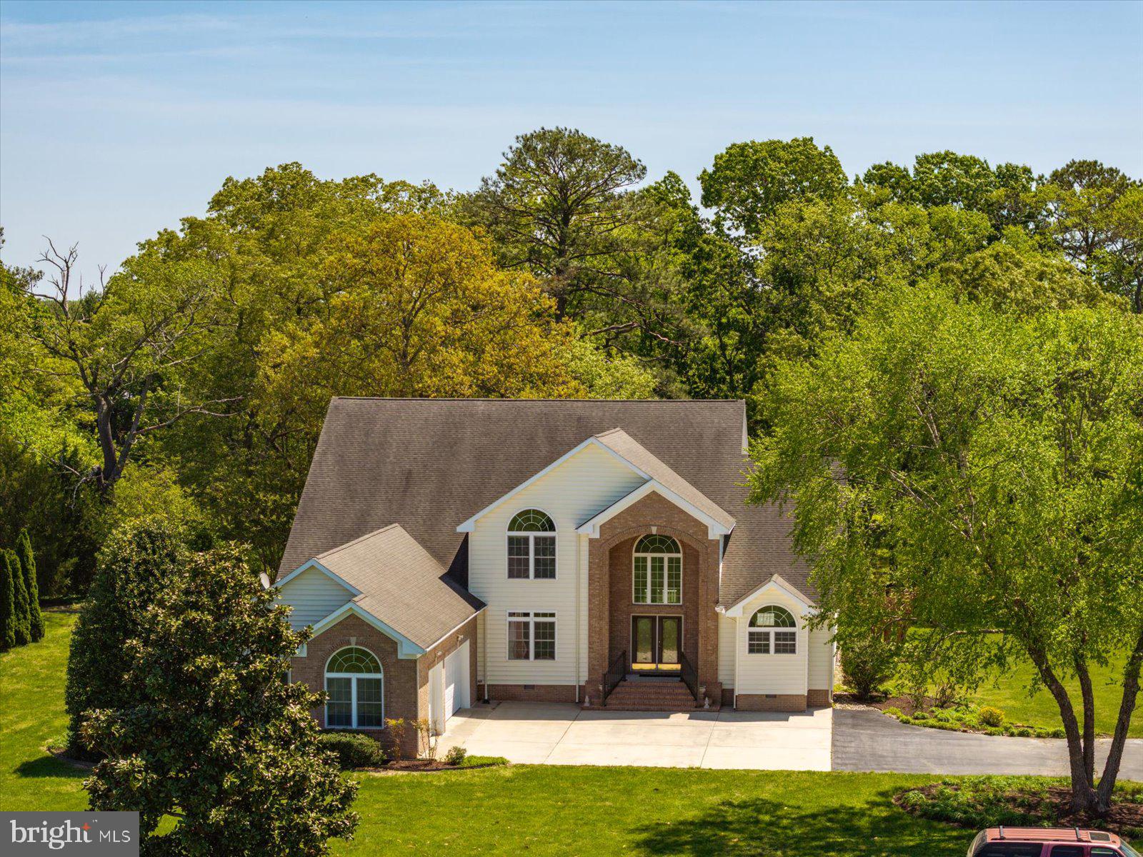 3431 Redden Ferry Road Eden, MD 21822 - Photo 95 of 103 a front view of a house with a yard and garage