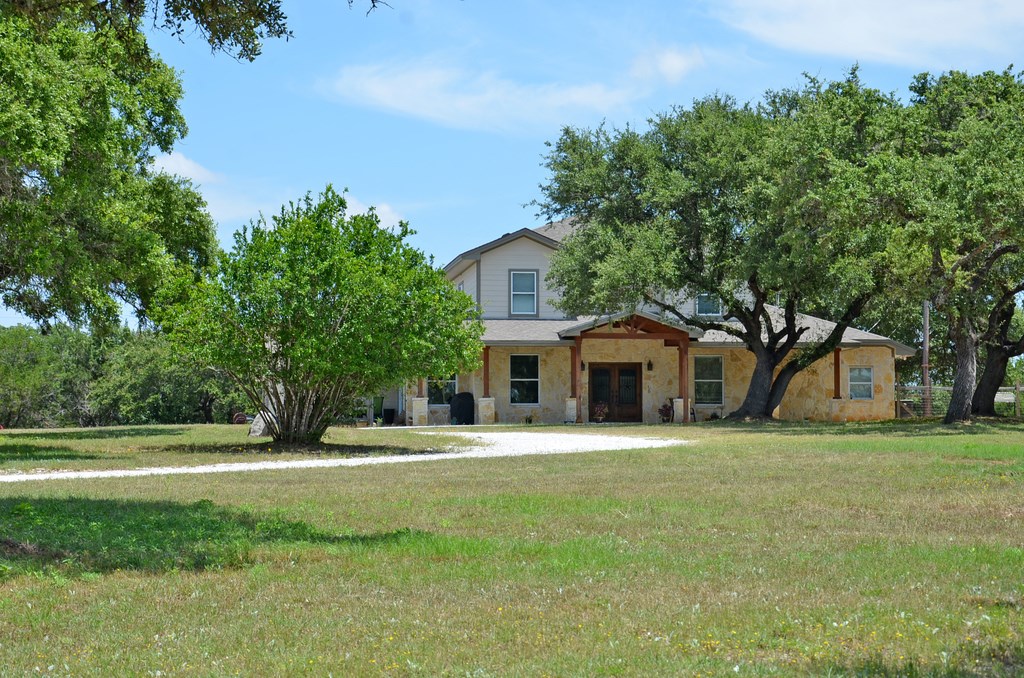 16713 Rocky Ridge Road Austin, TX 78734 - Photo 1 of 1 a front view of a house with a yard