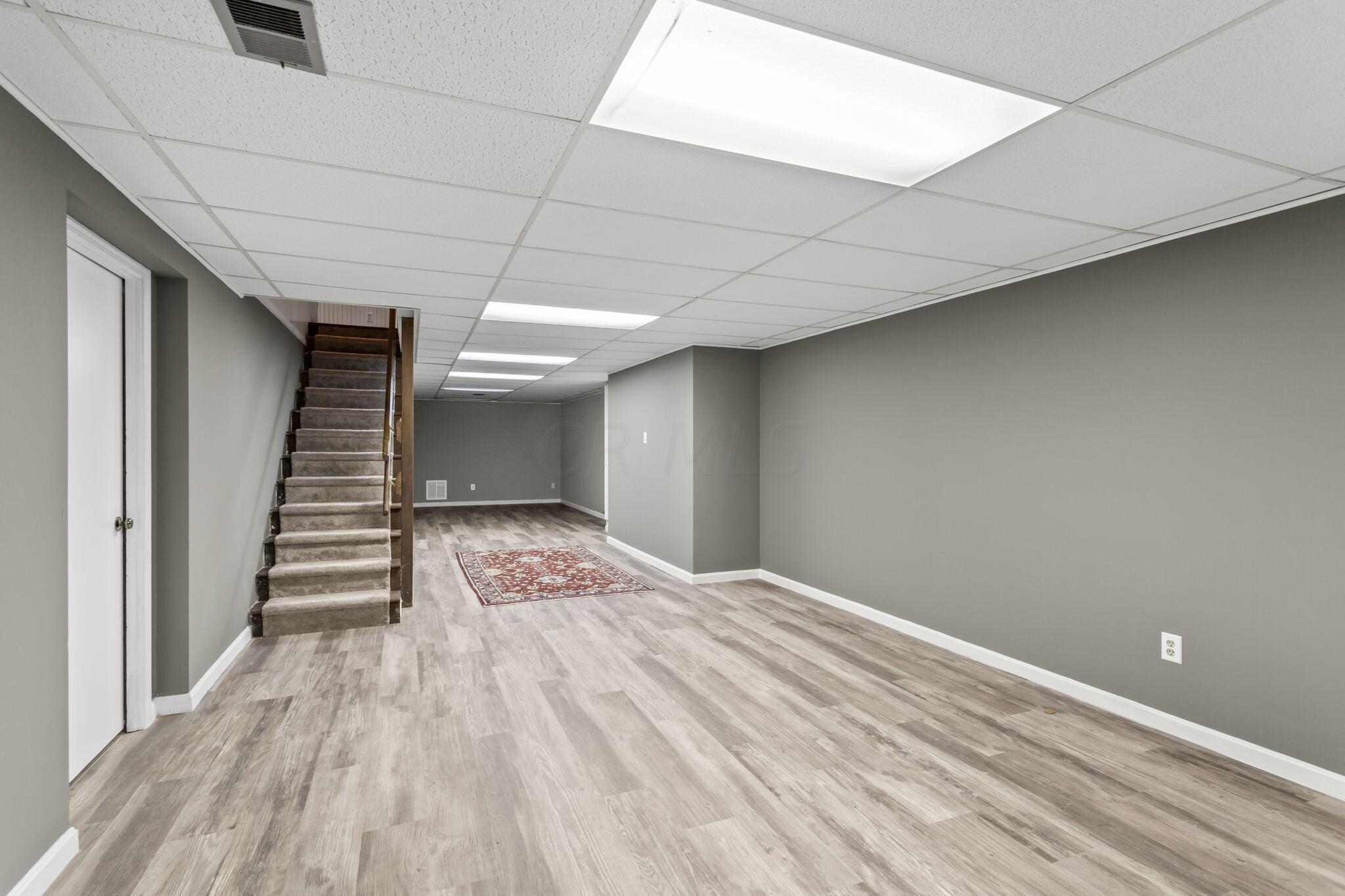 2111 Cheltenham Road Columbus, OH 43220 - Photo 45 of 64 Newly renovated basement finished living space add an extra 600 plus feet of flex space.