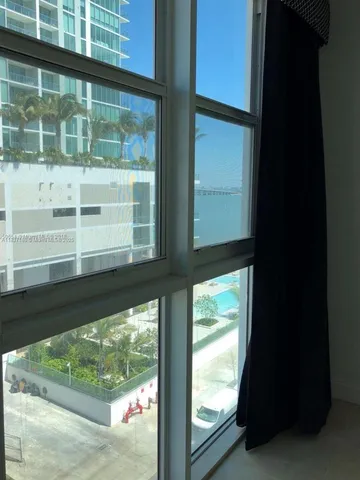 a view of a large window with an outdoor space