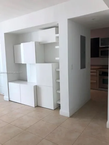 a view of kitchen and front door