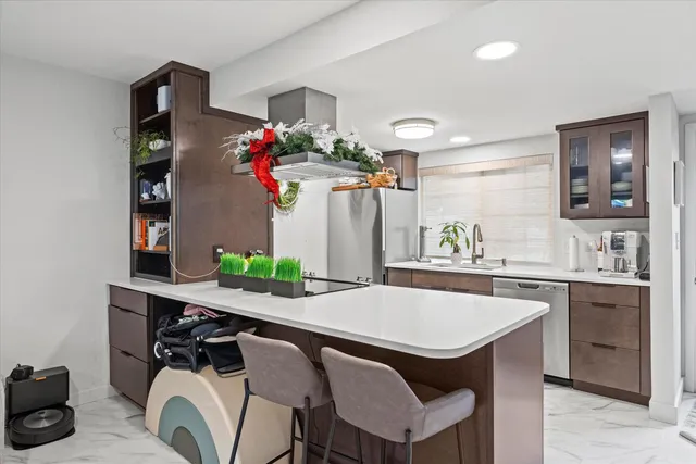a kitchen with a table and chairs in it