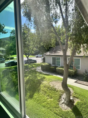a front view of a house with a yard balcony