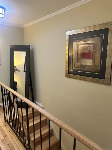 a view of a small space with wooden floor