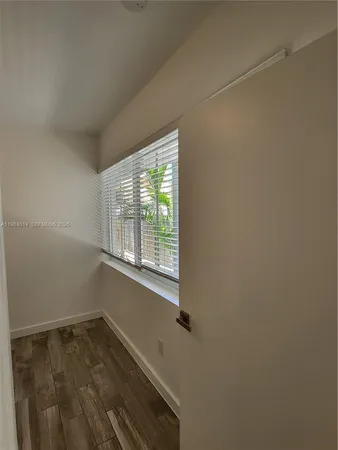 a view of a room that has a window in it