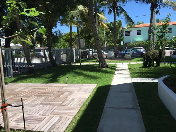 a view of a backyard with sitting area