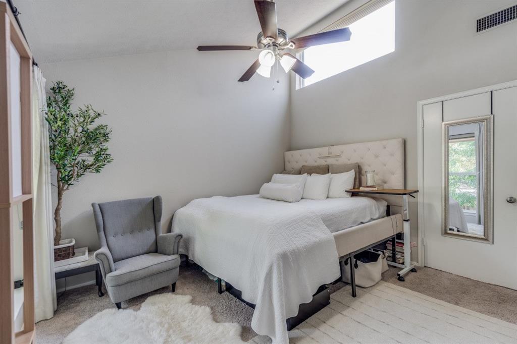 3736 Vitruvian Way, Unit D5 Addison, TX 75001 - Photo 10 of 27 a bedroom with a bed and a chair