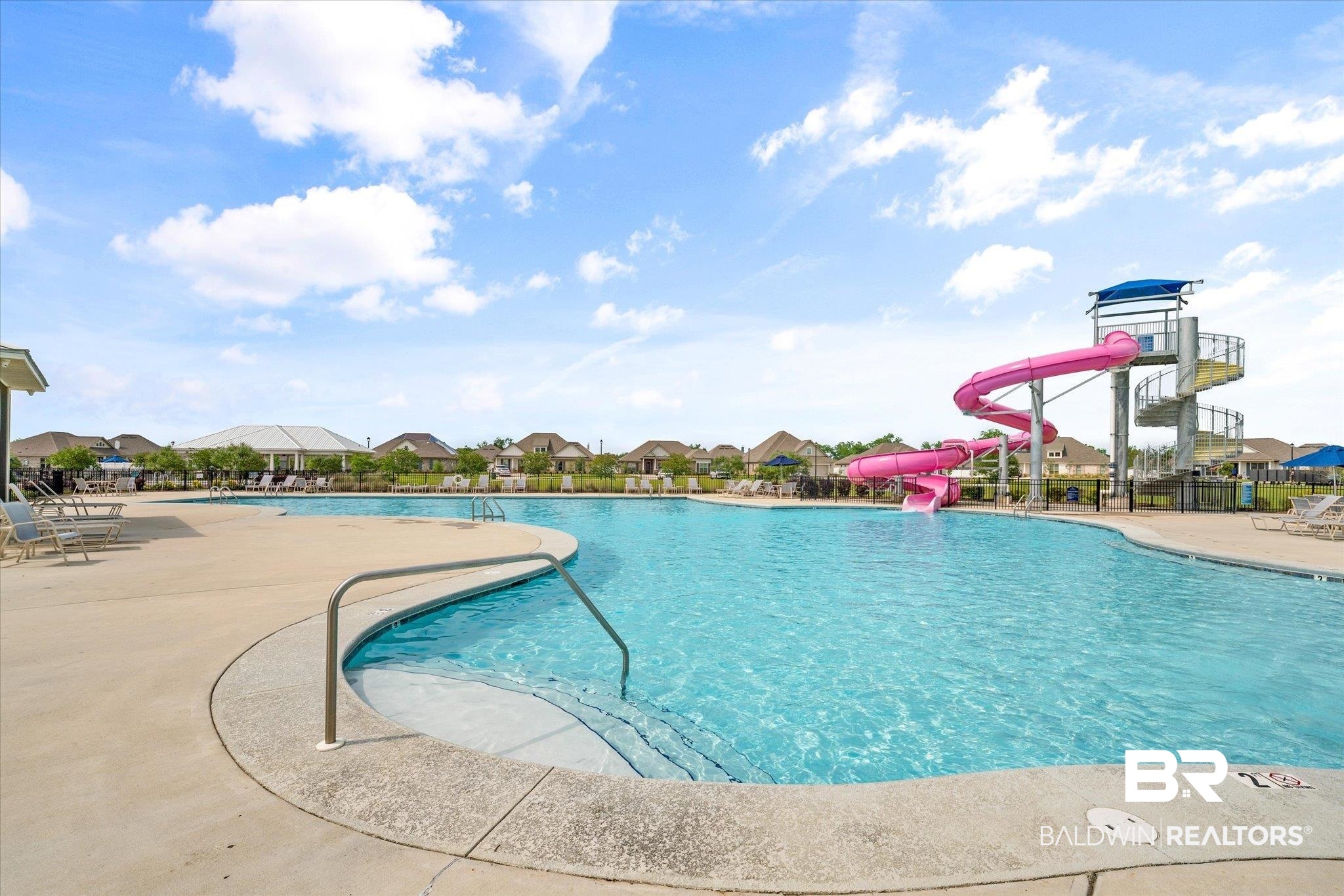 24262 Alydar Loop Daphne, AL 36526 - Photo 26 of 33 Community pool featuring a water slide, a patio area, and fence