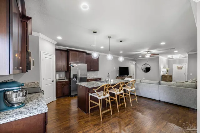 a large kitchen with a table and chairs in it