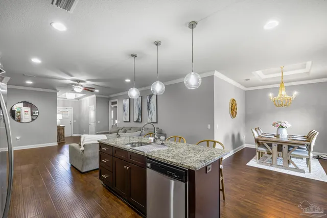 a kitchen with a table and chairs in it