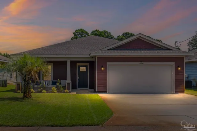 front view of a house with a yard