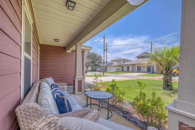 a view of a two chairs in the patio