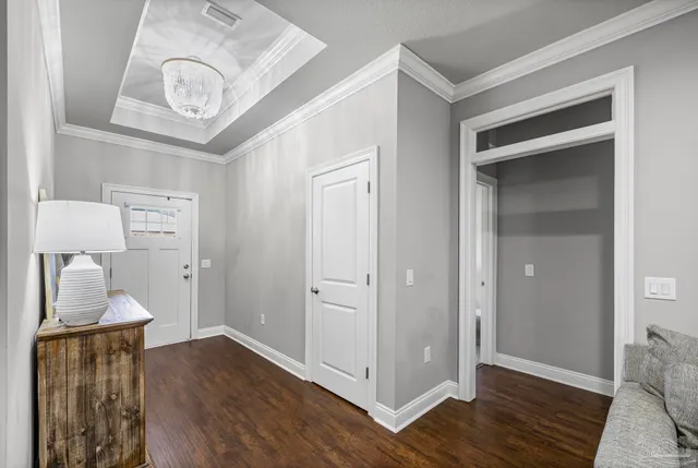 a view of an entryway with wooden floor