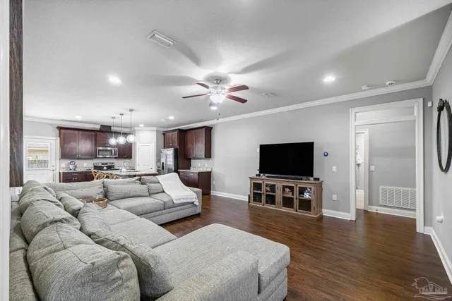 a living room with furniture and a flat screen tv