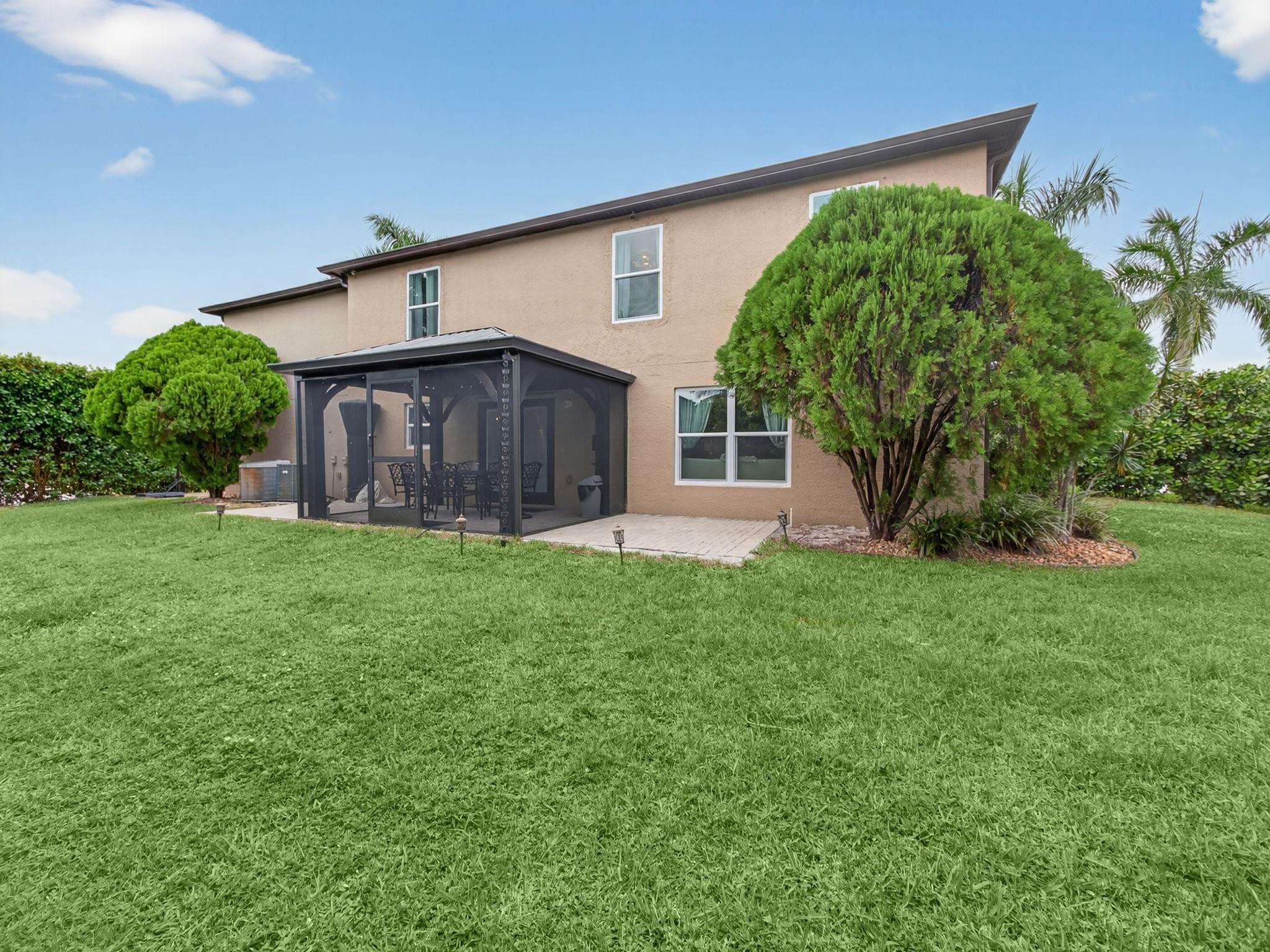 4125 Southwest Webb Street Port St. Lucie, FL 34953 - Photo 25 of 29 a view of a house with a yard