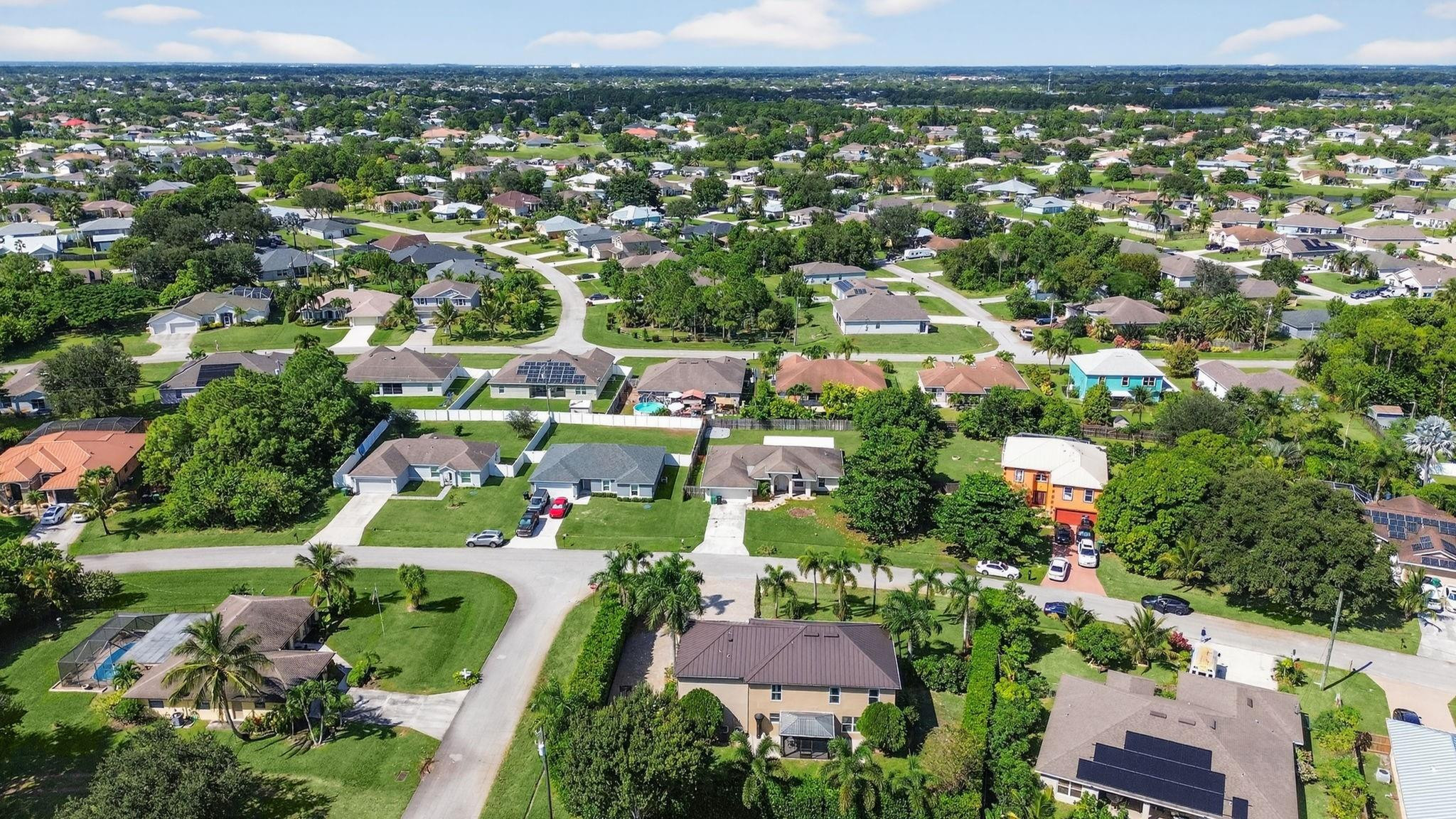 4125 Southwest Webb Street Port St. Lucie, FL 34953 - Photo 28 of 29 an aerial view of residential houses with outdoor space and trees