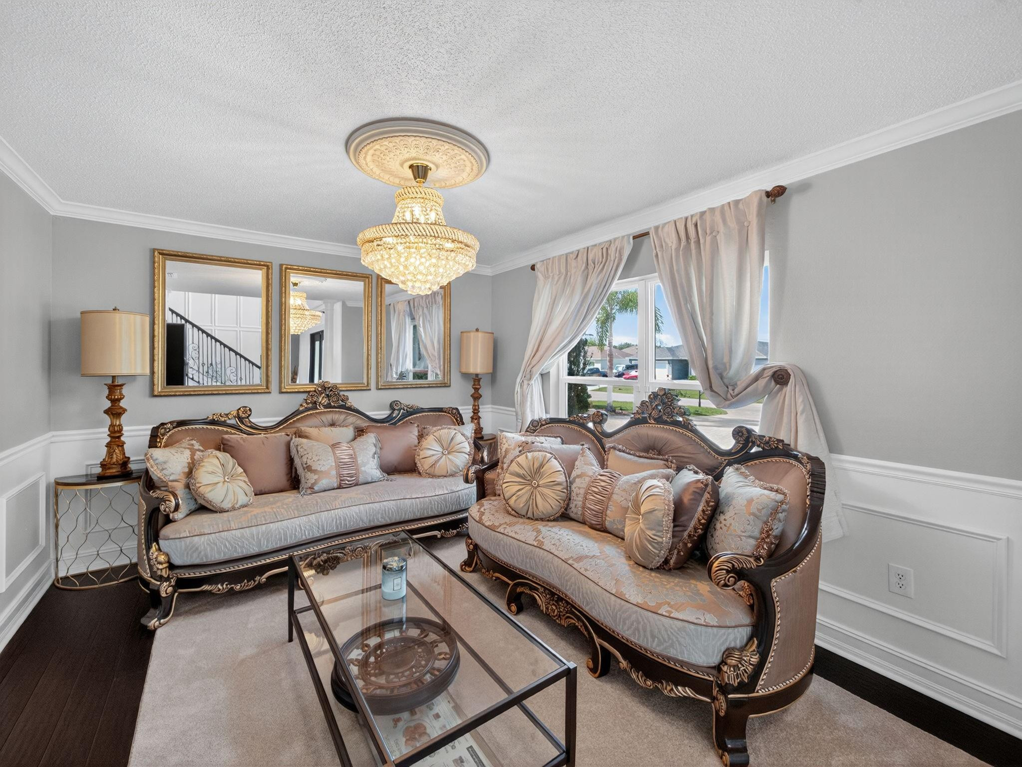 4125 Southwest Webb Street Port St. Lucie, FL 34953 - Photo 4 of 29 a living room with furniture and a chandelier
