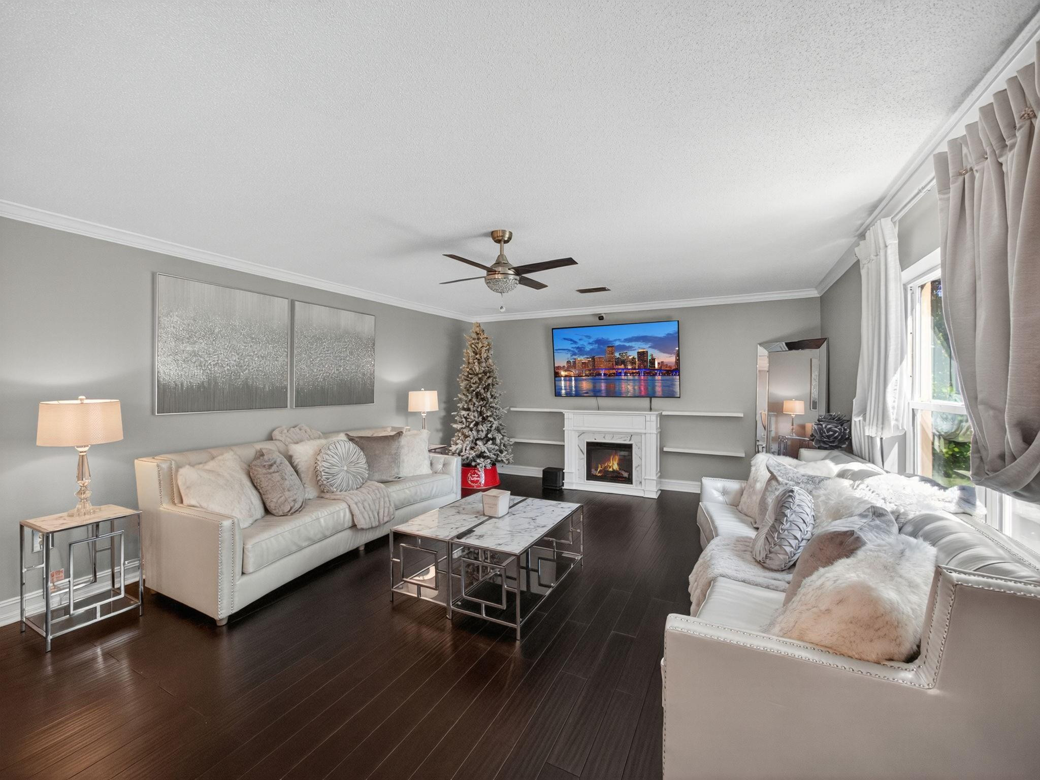 4125 Southwest Webb Street Port St. Lucie, FL 34953 - Photo 6 of 29 a living room with furniture fireplace and a large window