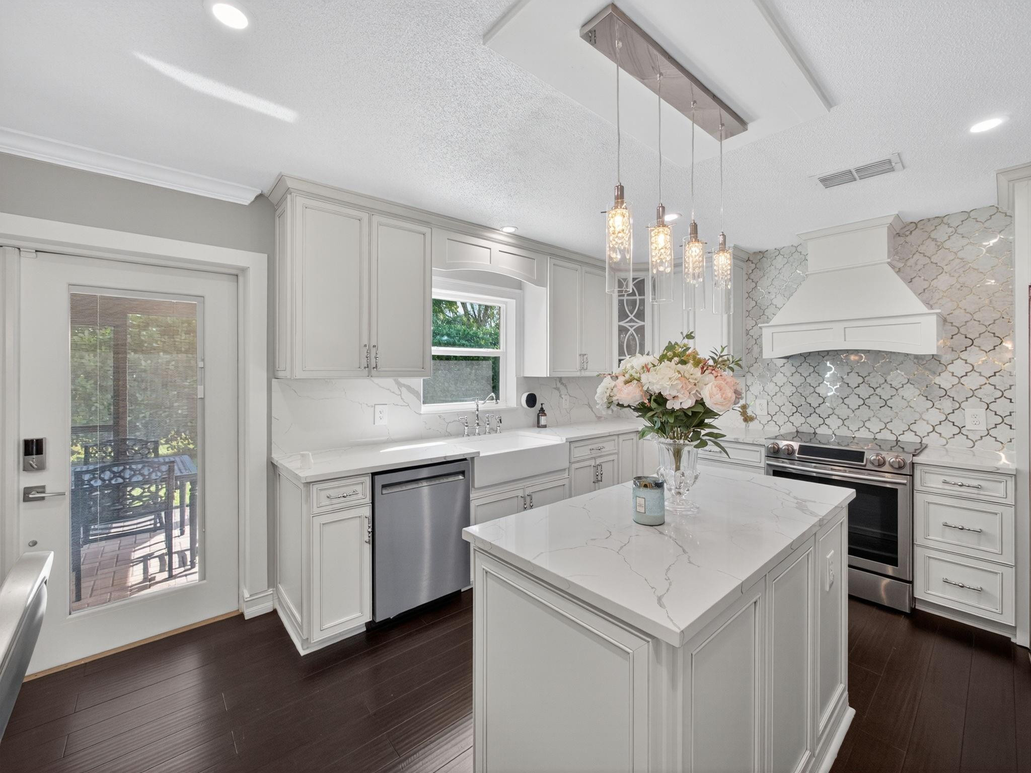 4125 Southwest Webb Street Port St. Lucie, FL 34953 - Photo 7 of 29 a kitchen with a sink a counter space and wooden floor