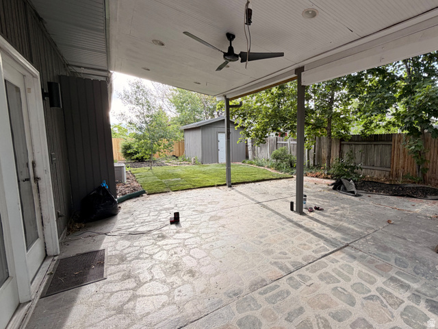 2163 Borg Drive Sandy, UT 84092 - Photo 29 of 31 Covered patio with a ceiling fan, featuring a stone-finish concrete surface